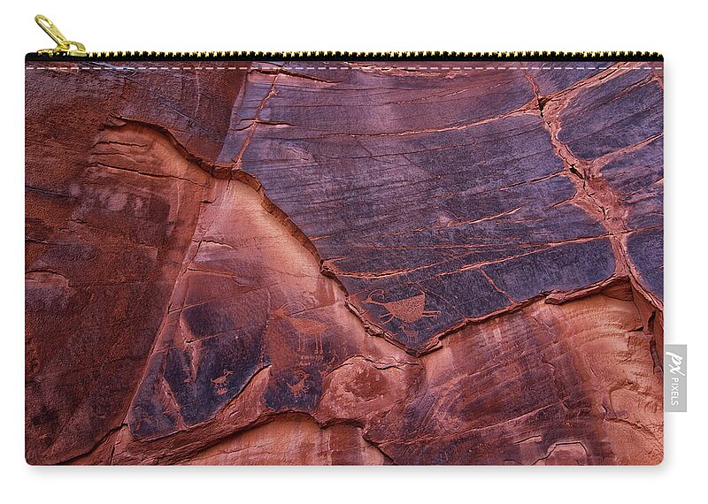 Petroglyphs Zip Pouch featuring the photograph Petroglyphs at Sun's Eye by Tom Kelly