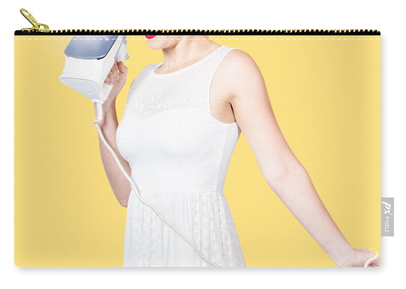 Cleaning Zip Pouch featuring the photograph Pin up woman providing steam clean ironing service by Jorgo Photography