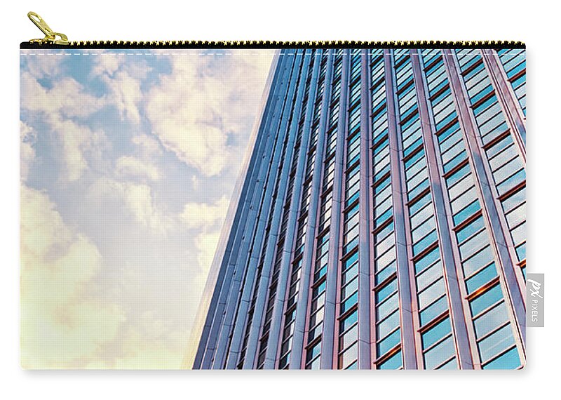 Corporate Business Zip Pouch featuring the photograph Pink Office Building In The Evening by Instamatics