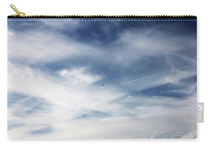Tranquility Zip Pouch featuring the photograph Plane In Flight by Richard Newstead