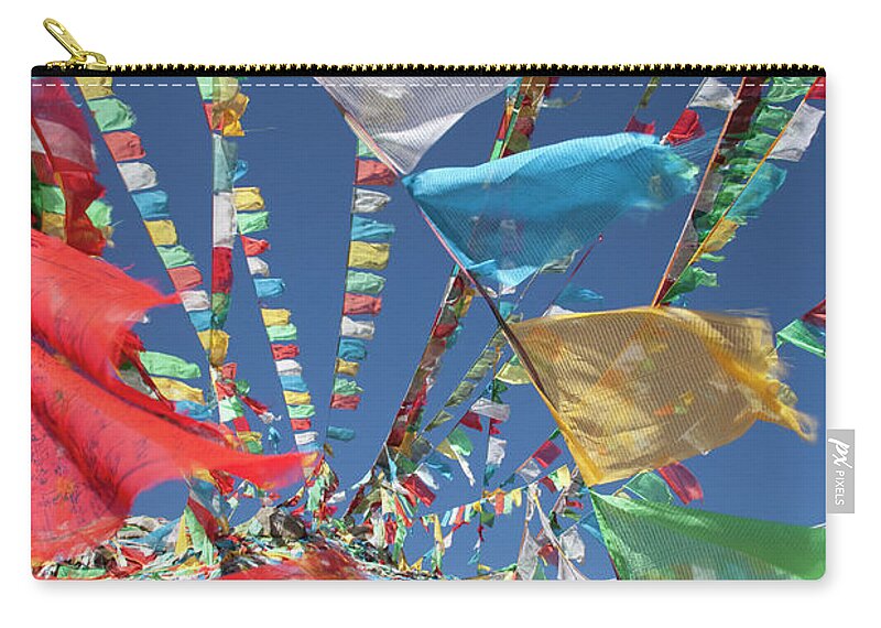 Chinese Culture Zip Pouch featuring the photograph Prayer Flags In Wind by Grant Faint