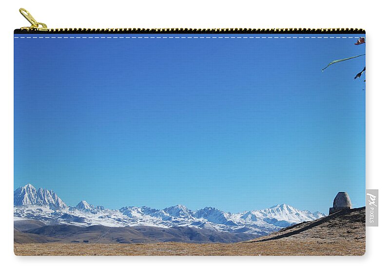 Tranquility Zip Pouch featuring the photograph Prayer Flags With Snow Peaks Background by Photo By Tormod Sandtorv