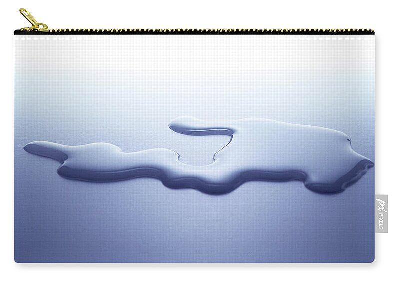 Purity Zip Pouch featuring the photograph Puddle Of Water On White Surface by Nicholas Eveleigh