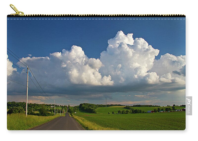 Tranquility Zip Pouch featuring the photograph Puffysummer Clouds And Country Farm Road by Matt Champlin