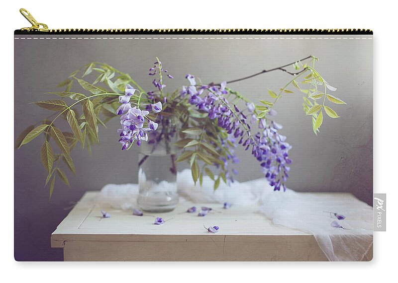 Purple Zip Pouch featuring the photograph Purple Flowers On White Table by Copyright Anna Nemoy(xaomena)