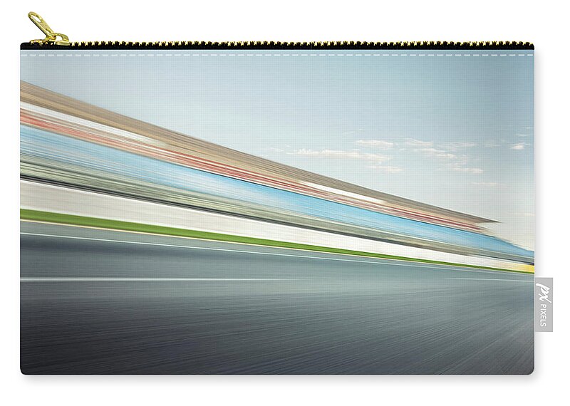 Blurred Motion Zip Pouch featuring the photograph Race Track Stand by Aaron Foster