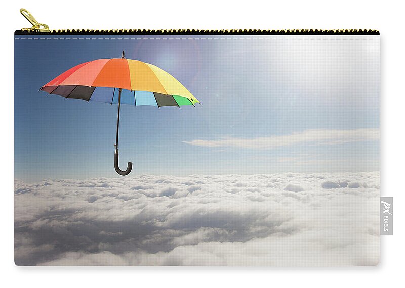 Mid-air Zip Pouch featuring the photograph Rainbow Umbrella Floating Above Clouds by Gary S Chapman