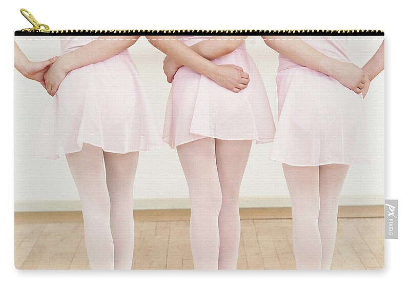 Ballet Dancer Zip Pouch featuring the photograph Rear View Of Three Young Ballet Dancers by Digital Vision.