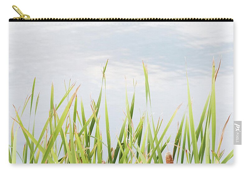 Grass Zip Pouch featuring the photograph Reeds And Tall Grasses Against A Pond by Jon Schulte