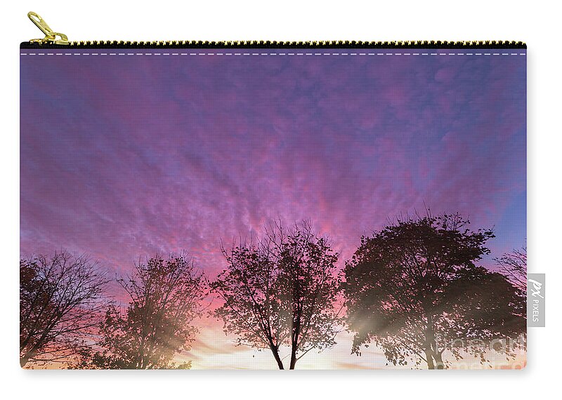 Alone Zip Pouch featuring the photograph Rural purple sunset over winter trees by Simon Bratt