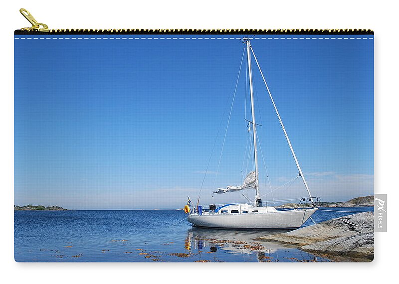 Archipelago Zip Pouch featuring the photograph Sailing Boat In The Swedish Archipelago by Mdesign se