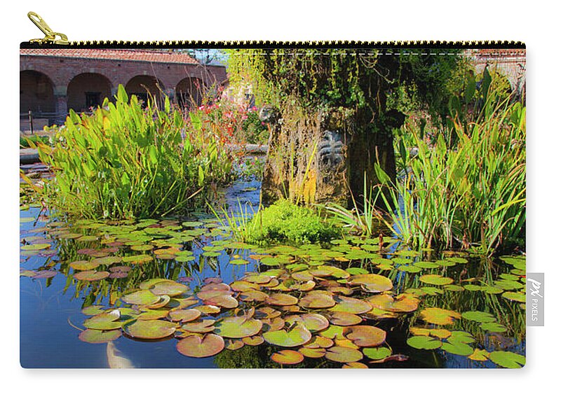 Koi Pond And Fountain Zip Pouch featuring the photograph San Juan Capistrano California Mission Lotus Flower with Koi by Catherine Walters