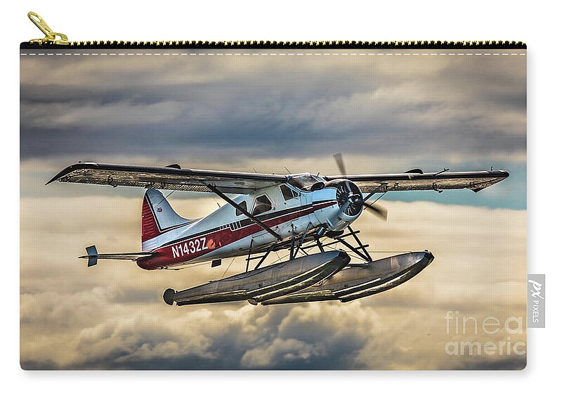 Seaplane Carry-all Pouch featuring the photograph Seaplane in the Anchorage sky by Lyl Dil Creations