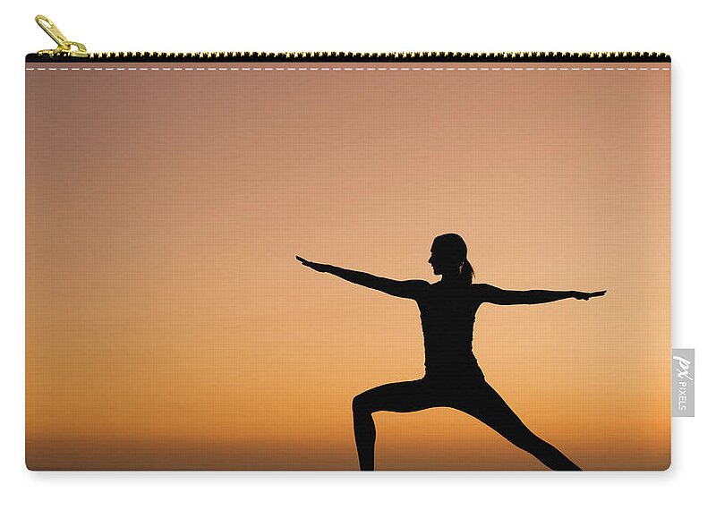 Tranquility Zip Pouch featuring the photograph Silhouette Of Woman Doing Yoga by Erik Isakson