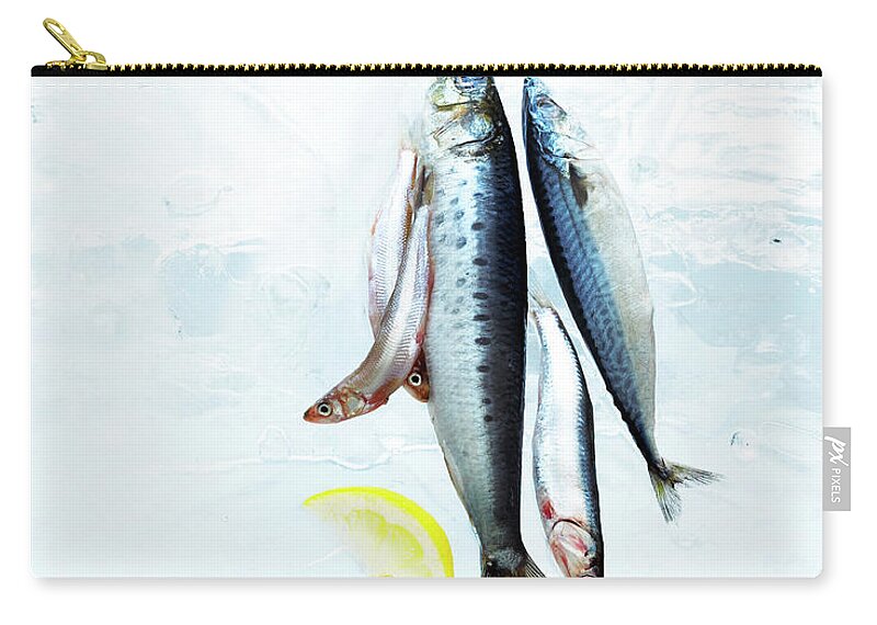 White Background Zip Pouch featuring the photograph Small Fish On Block Of Ice With Lemon by Annabelle Breakey