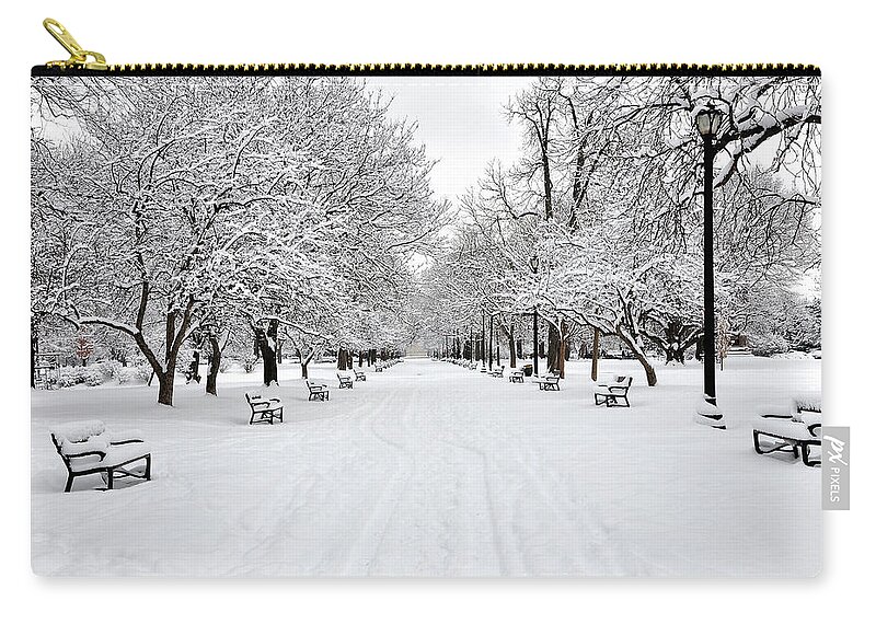Snow Zip Pouch featuring the photograph Snow Covered Benches And Trees In by Shobeir Ansari