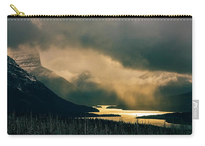 Glacier National Park Zip Pouch featuring the photograph Snowstorm, St. Mary's Lake by Todd Bannor