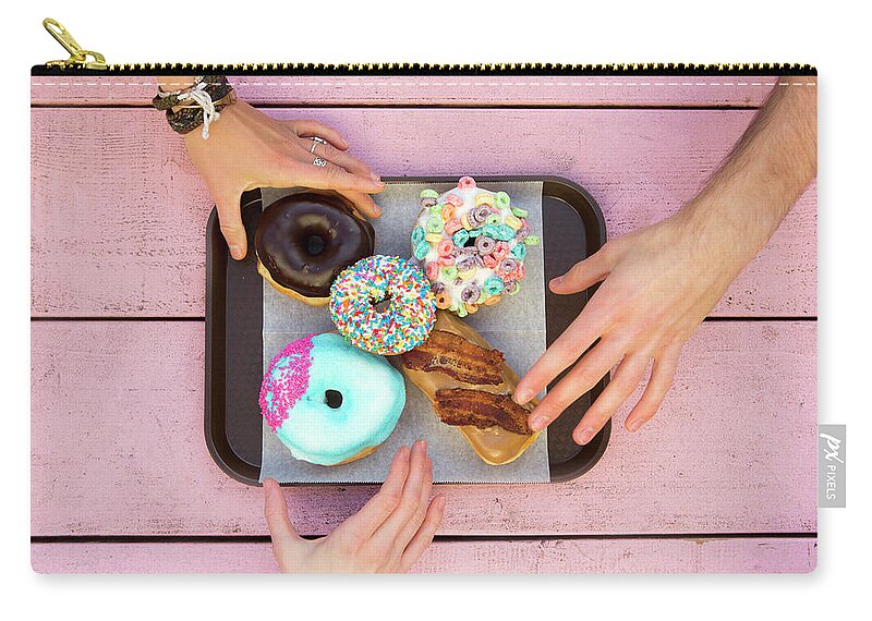 Young Men Zip Pouch featuring the photograph Specialty Doughnuts On A Tray by Jordan Siemens