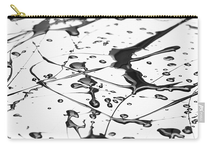 Curve Zip Pouch featuring the photograph Splattered Black Paint Making A Complex by Ralf Hiemisch