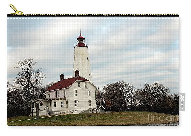 Lighthouse Zip Pouch featuring the photograph Sandy Hook Lighthouse by Sam Rino