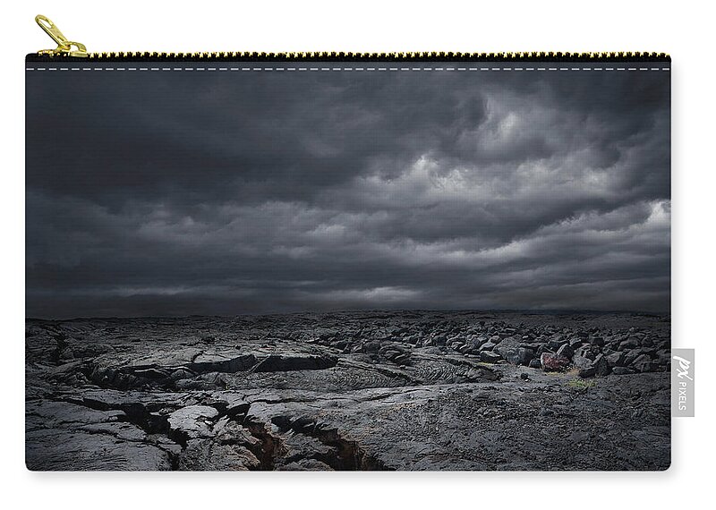 Mauna Loa Zip Pouch featuring the photograph Storm Clouds Over Dry Rocky Landscape by Chris Clor