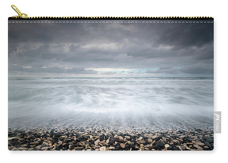 Coast Zip Pouch featuring the photograph Stormy Sky and Wavy ocean by Michalakis Ppalis