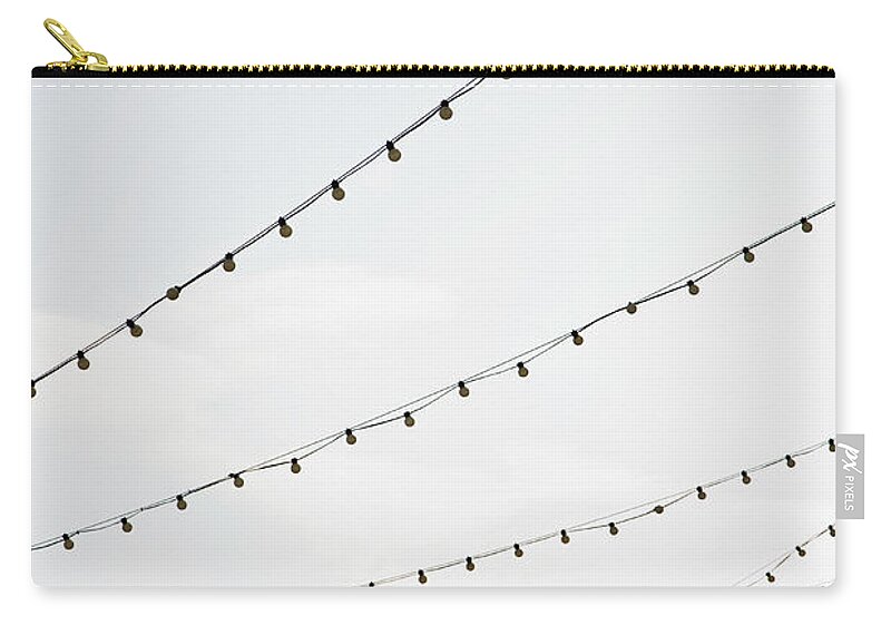 Hanging Zip Pouch featuring the photograph Strings Of Lights by Frederick Bass