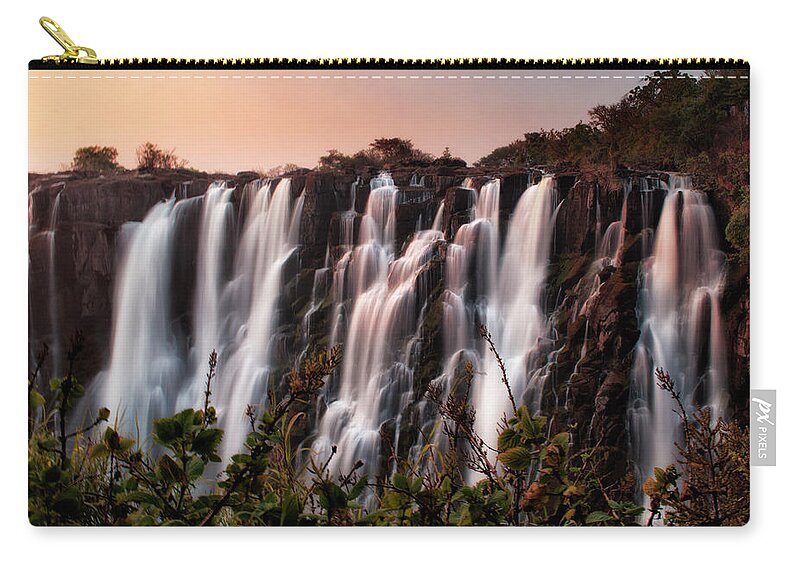 Scenics Zip Pouch featuring the photograph Sundowner At Victoria Falls, Zambia by Bhawika Nana Photography