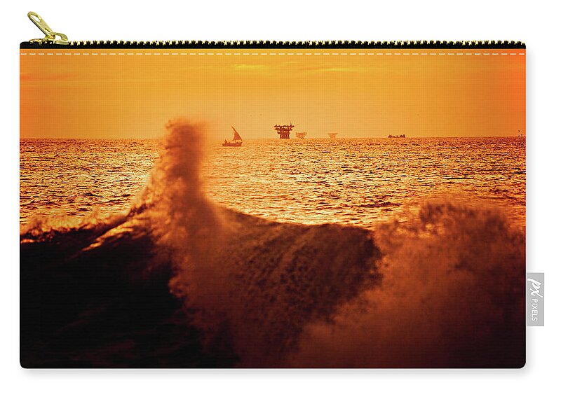 Scenics Zip Pouch featuring the photograph Sunset Behind An Oil Platform In The by Epicurean