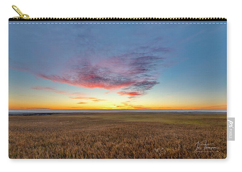 Badlands Zip Pouch featuring the photograph Sunset Over Grasslands by Jim Thompson