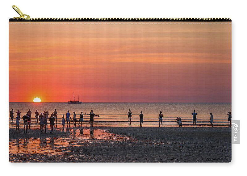Darwin Zip Pouch featuring the photograph Sunset over Mindil Beach by Racheal Christian