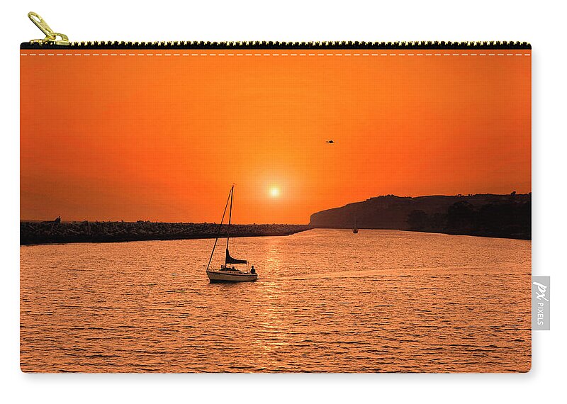 Sailing At Sunset Zip Pouch featuring the photograph Sunset Sail by Don Spenner