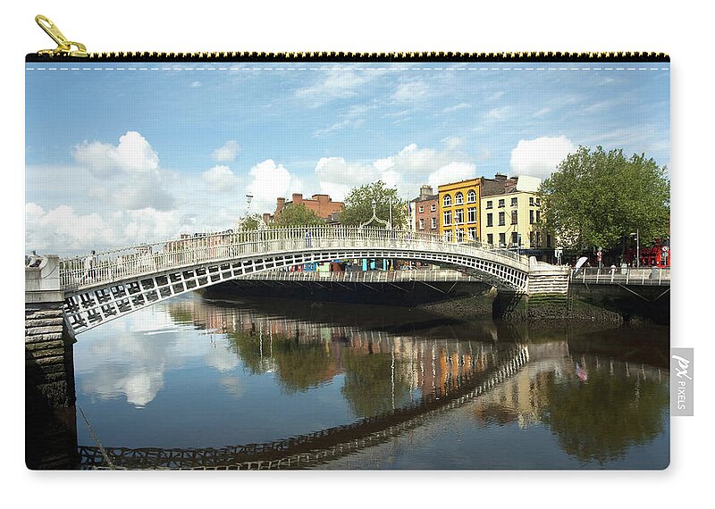 Dublin Zip Pouch featuring the photograph The Famous Hapenny Bridge In Dublin by Stevenallan