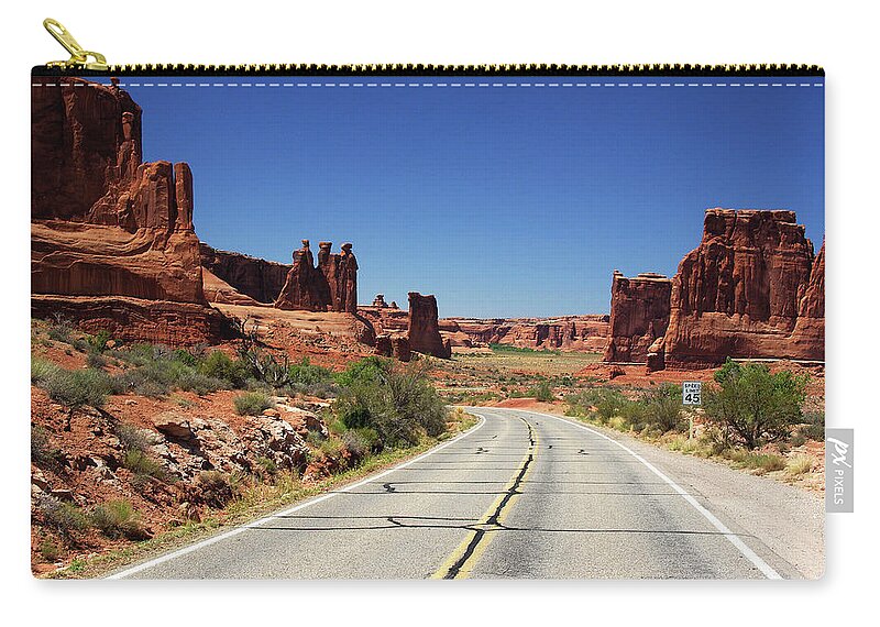 Tranquility Zip Pouch featuring the photograph The Road by Iñigo Fdz De Pinedo