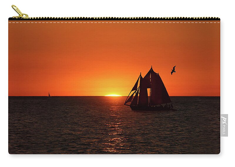 Sunset Zip Pouch featuring the photograph The Sunset with a Yacht by Aleksander Rotner