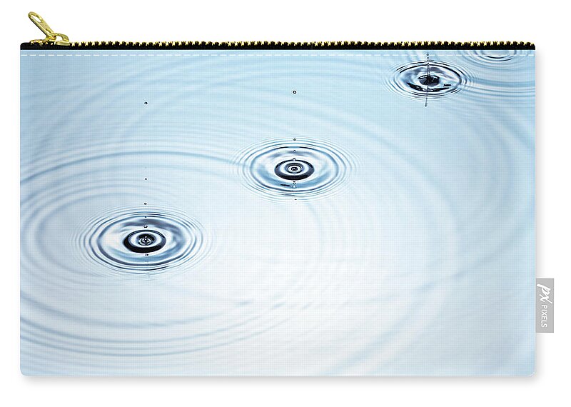 Purity Zip Pouch featuring the photograph Three Drops Of Water Falling Into A by Pier