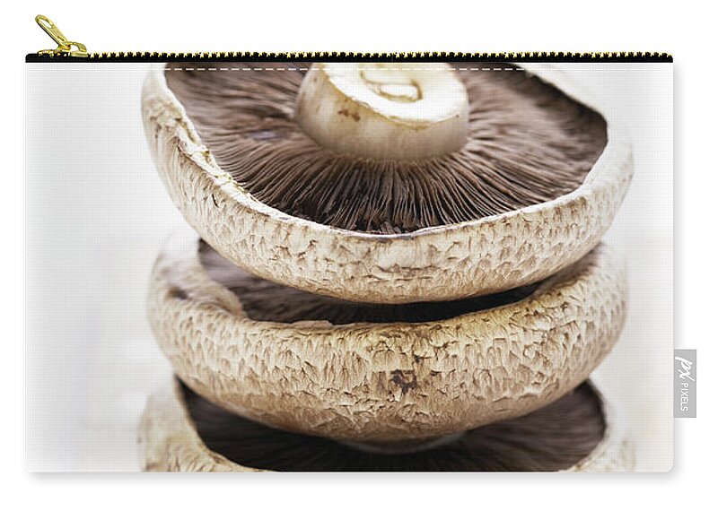 White Background Zip Pouch featuring the photograph Three Flat Mushrooms In Pile On Wooden by Martin Poole