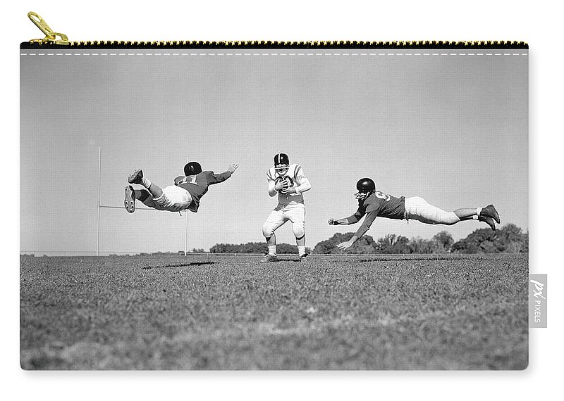 American Football Uniform Zip Pouch featuring the photograph Three Teenage Boys Playing American by H. Armstrong Roberts