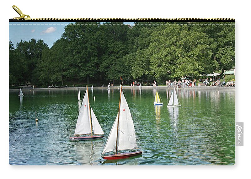 Recreational Pursuit Zip Pouch featuring the photograph Toy Boats In Water by Terraxplorer