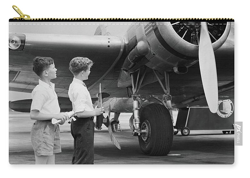 Child Zip Pouch featuring the photograph Two Boys Standing Next To Propeller by H. Armstrong Roberts