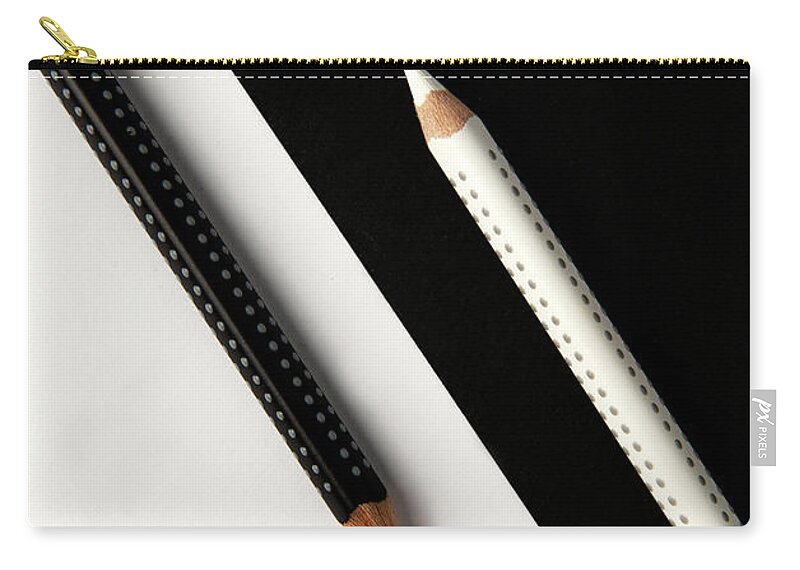 Pencil Zip Pouch featuring the photograph Two drawing pencils on a black and white surface. by Michalakis Ppalis