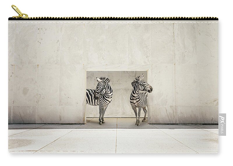Out Of Context Zip Pouch featuring the photograph Two Zebras At Doorway Of Large White by Matthias Clamer