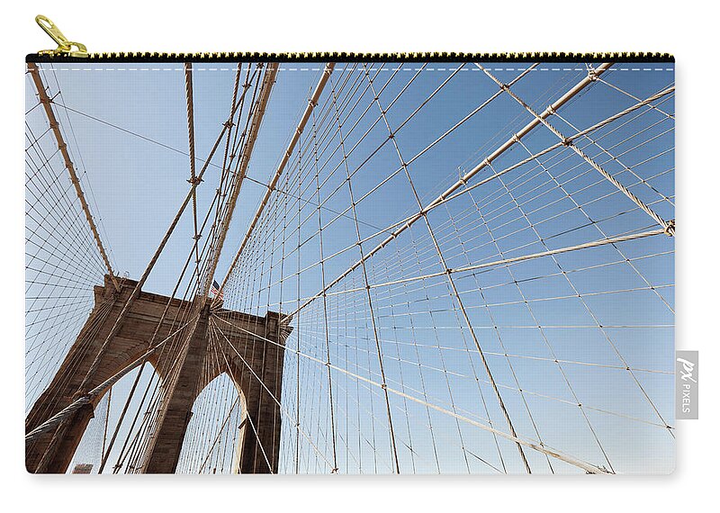 Downtown District Zip Pouch featuring the photograph View Of Brooklyn Bridge In Nyc by Naphtalina