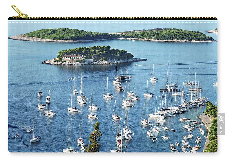 Adriatic Sea Zip Pouch featuring the photograph View Of Hvar Harbor From Castle by Ermingut