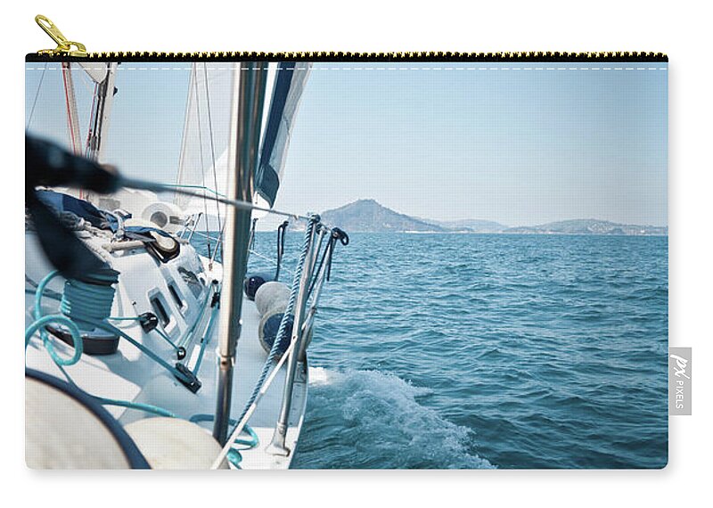 Wind Zip Pouch featuring the photograph View Of Sailing Boat by Piccerella