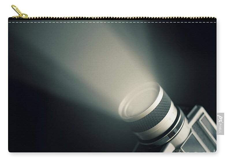 Camera Zip Pouch featuring the photograph Vintage film camera super 8mm with spotlight over black backgrou by Jelena Jovanovic