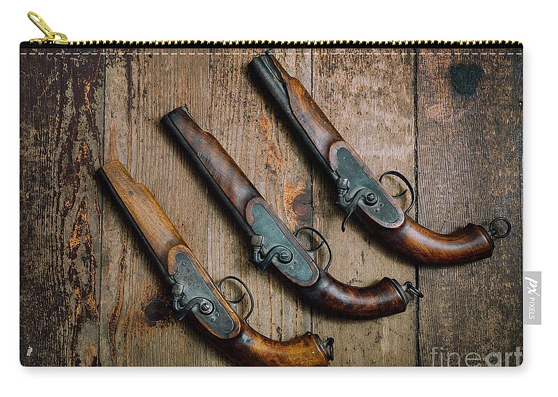 Pistol Zip Pouch featuring the photograph Vintage Pistols on Rustic wooden background by Jelena Jovanovic
