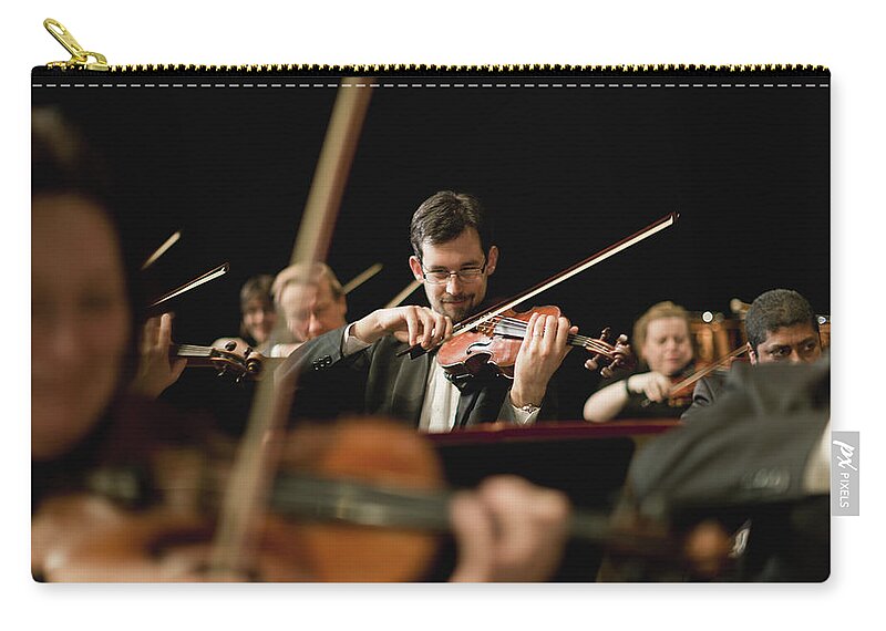 Young Men Zip Pouch featuring the photograph Violin Players In Orchestra by Hybrid Images