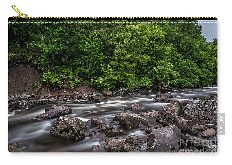 Background Zip Pouch featuring the photograph Wild Mountain River Streaming Through Green Forest in Scotland by Andreas Berthold