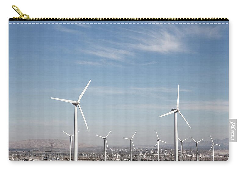Environmental Conservation Zip Pouch featuring the photograph Wind Farm In The Dessert by Frank Rothe